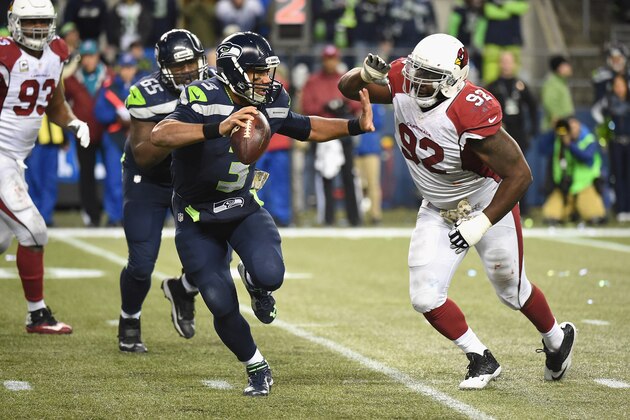 SEATTLE, WA - NOVEMBER 15: Russell Wilson #3 of the Seattle Seahawks scrambles during the fourth quarter as he is pressured by Frostee Rucker #92 of the Arizona Cardinals at CenturyLink Field on November 15, 2015 in Seattle, Washington. (Photo by Steve Dykes/Getty Images) SEATTLE, WA - NOVEMBER 15: Russell Wilson #3 of the Seattle Seahawks scrambles during the fourth quarter as he is pressured by Frostee Rucker #92 of the Arizona Cardinals at CenturyLink Field on November 15, 2015 in Seattle, Washington. (Photo by Steve Dykes/Getty Images)