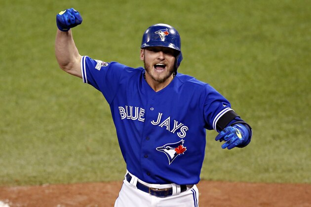 Toronto Blue Jays' Josh Donaldson celebrates his two run home run against the Kansas City Royals during the third inning in Game 3 of baseball's American League Championship Series on Monday, Oct. 19, 2015, in Toronto. (AP Photo/Paul Sancya)