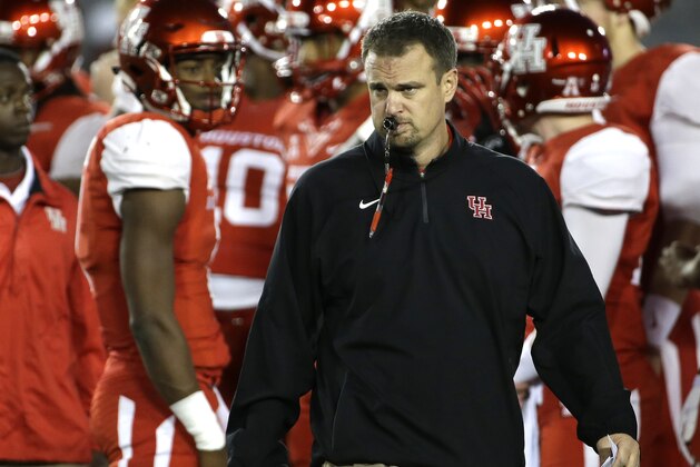 Houston coach Tom Herman watches his team warm up before an NCAA college football game against Memphis Saturday, Nov. 14, 2015, in Houston. (AP Photo/David J. Phillip)