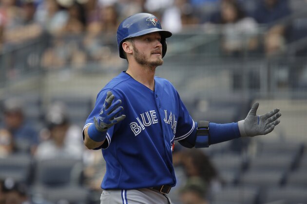 Toronto Blue Jays' Josh Donaldson reacts after hitting a solo home run during the first inning of the baseball game against the New York Yankees at Yankee Stadium, Sunday, Aug. 9, 2015, in New York. (AP Photo/Seth Wenig)