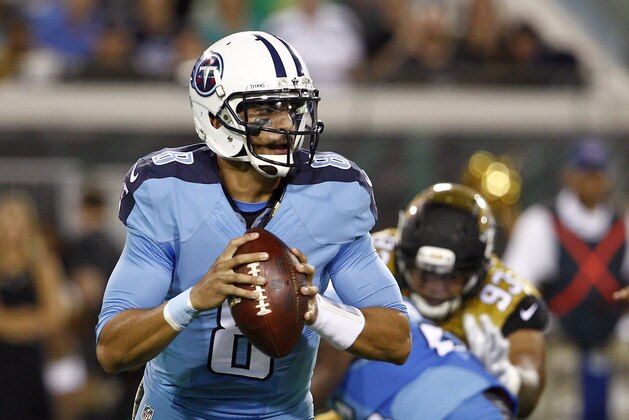 Nov 19, 2015; Jacksonville, FL, USA;  Tennessee Titans quarterback Marcus Mariota (8) drops to throw a pass during the first quarter of a football game against the Jacksonville Jaguars at EverBank Field. Mandatory Credit: Reinhold Matay-USA TODAY Sports