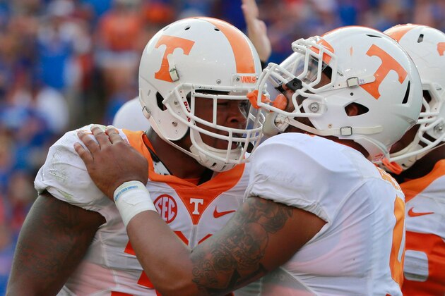 Sep 26, 2015; Gainesville, FL, USA; Tennessee Volunteers linebacker Darrin Kirkland Jr. (34) and  defensive end Derek Barnett (9) celebrate during the second half at Ben Hill Griffin Stadium. Florida Gators defeated the Tennessee Volunteers 28-27. Mandatory Credit: Kim Klement-USA TODAY Sports