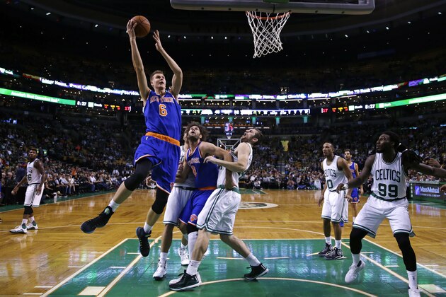New York Knicks forward Kristaps Porzingis, of Latvia, (6) drives to the basket against the Boston Celtics during the first half of a preseason NBA basketball game in Boston, Thursday, Oct. 22, 2015. (AP Photo/Charles Krupa)