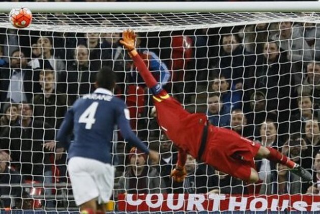 France captain and goalkeeper Hugo Lloris is beaten by England’s Dele Alli scoring the opening goal during the international friendly soccer match between England and France at Wembley Stadium in London, Tuesday, Nov. 17, 2015. France is playing England at Wembley on Tuesday after the countries decided the match should go ahead despite the deadly attacks in Paris last Friday night which killed scores of people. (AP Photo/Kirsty Wigglesworth)