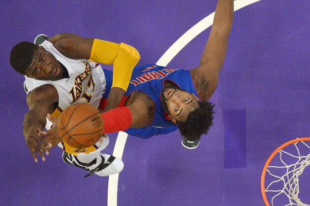 Los Angeles Lakers center Roy Hibbert, left, shoots as Detroit Pistons center Andre Drummond defends during the first half of an NBA basketball game, Sunday, Nov. 15, 2015, in Los Angeles. (AP Photo/Mark J. Terrill)