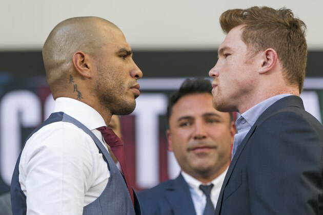 Boxers, Miguel Cotto, from Puerto Rico, left, WBC, Ring Magazine and Lineal Middleweight World Champion and Saul