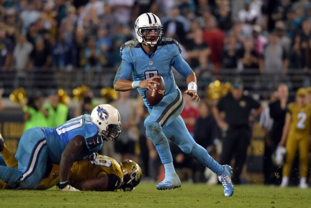 Nov 19, 2015; Jacksonville, FL, USA; Tennessee Titans quarterback Marcus Mariota (8) carries the ball during an NFL football game against the Jacksonville Jaguars at EverBank Field. The Jaguars defeated the Titans 19-13. Mandatory Credit: Kirby Lee-USA TODAY Sports