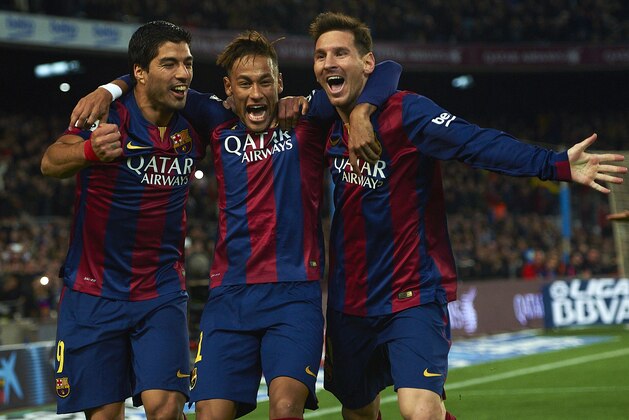 FC Barcelona's Lionel Messi, from Argentine, right, Neymar, from Brazil, center, and Luis Suarez, from Uruguay, celebrate after scoring against Atletico Madrid during a Spanish La Liga soccer match at the Camp Nou stadium in Barcelona, Spain, Sunday, Jan. 11, 2015. (AP Photo/Siu Wu)