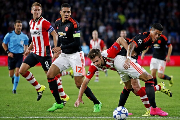 (L-R) Davy Propper of PSV, Marcos Rojo of Manchester United during the UEFA Champions League group B match between PSV Eindhoven and Manchester United on September 15, 2015 at the Philips stadium in Eindhoven, The Netherlands.(Photo by VI Images via Getty Images)