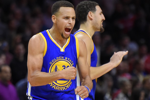 Golden State Warriors guard Stephen Curry, left, celebrates along with guard Klay Thompson during the second half of an NBA basketball game against the Los Angeles Clippers, Thursday, Nov. 19, 2015, in Los Angeles. The Warriors won 124-117. (AP Photo/Mark J. Terrill)