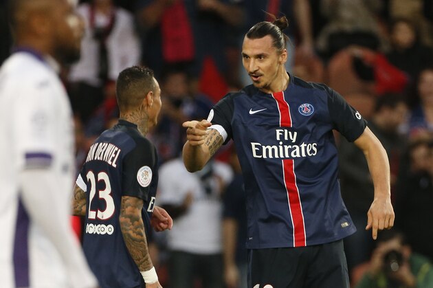LYON, FRANCE - NOVEMBER 8: Zlatan Ibrahimovic of PSG celebrates his first goal with Gregory Van Der Wiel of PSG (left) during the French Ligue 1 match between Olympique Lyonnais (OL) and AS Saint-Etienne (ASSE) at Stade de Gerland on November 8, 2015 in Lyon, France. (Photo by Jean Catuffe/Getty Images)