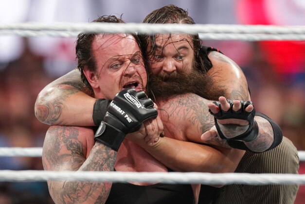 Bray Wyatt keeps his opponent The Undertaker in a hold at Wrestlemania XXXI, on Sunday, March 29, 2015 in Santa Clara, CA. 2015 marks the first year Wrestlemania will be held in the San Francisco Bay Area, being made available to viewers in 177 countries via the WWE Network. (Don Feria/AP Images for WWE)