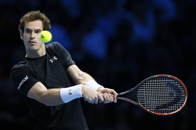 Andy Murray of Britain plays a return to Rafael Nadal of Spain during their singles tennis match at the ATP World Tour Finals at the O2 Arena in London, Wednesday, Nov. 18, 2015. (AP Photo/Kirsty Wigglesworth)