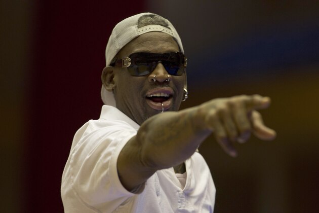 Dennis Rodman coaches as North Korean and U.S. basketball players practice in Pyongyang, North Korea on Tuesday, Jan. 7, 2014. Rodman came to the North Korean capital with a squad of U.S. basketball stars for an exhibition game on Jan. 8, the birthday of North Korean leader Kim Jong Un.  (AP Photo/Kim Kwang Hyon)