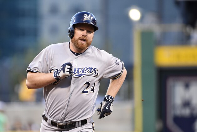 Milwaukee Brewers' Adam Lind trots around the bases after hitting a homerun during a game against the Pittsburgh Pirates, Friday, Sept. 11, 2015, in Pittsburgh.  (AP Photo/Fred Vuich)