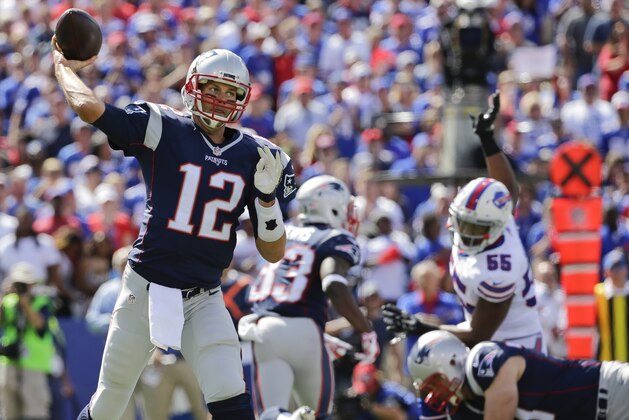 New England Patriots' Tom Brady (12) throws a pass during the first half of an NFL football game against the Buffalo Bills Sunday, Sept. 20, 2015, in Orchard Park, N.Y. (AP Photo/Bill Wippert)