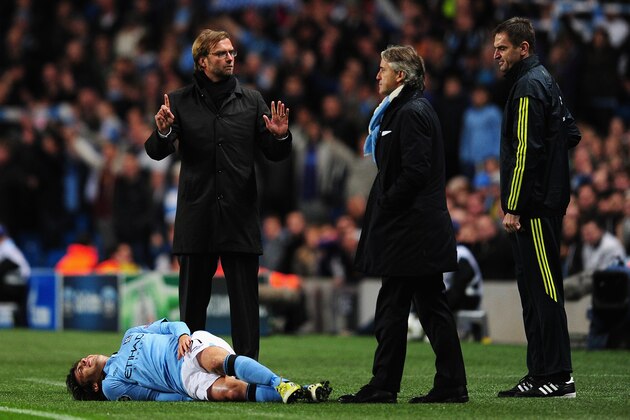 MANCHESTER, ENGLAND - OCTOBER 03:  Borussia Dortmund Manager Jurgen Klopp looks on as David Silva of Manchester City reacts during the UEFA Champions League Group D match between Manchester City and Borussia Dortmund at the Etihad Stadium on October 3, 2012 in Manchester, England.  (Photo by Stu Forster/Getty Images)