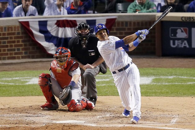Chicago Cubs shortstop Starlin Castro (13) hits a home run against the St. Louis Cardinals during the fourth inning of Game 3 in baseball's National League Division Series, Monday, Oct. 12, 2015, in Chicago. (AP Photo/Charles Rex Arbogast)