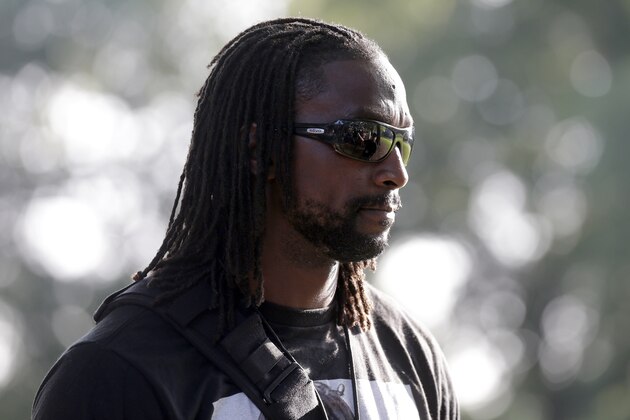 Carolina Panthers' Charles Tillman arrives at the NFL football team's training camp in Spartanburg, S.C., Thursday, July 30, 2015. (AP Photo/Chuck Burton)