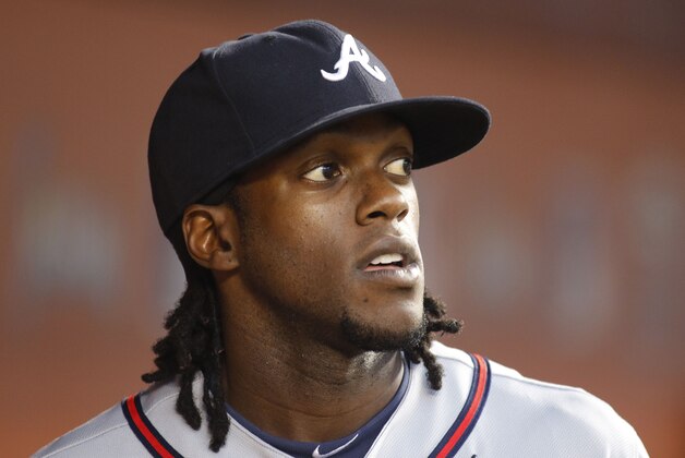 Atlanta Braves center fielder Cameron Maybin (25) looks to the field from the dugout as the Braves played the Miami Marlins in a baseball game in Miami, Saturday Sept. 26, 2015. (AP Photo/Joe Skipper)