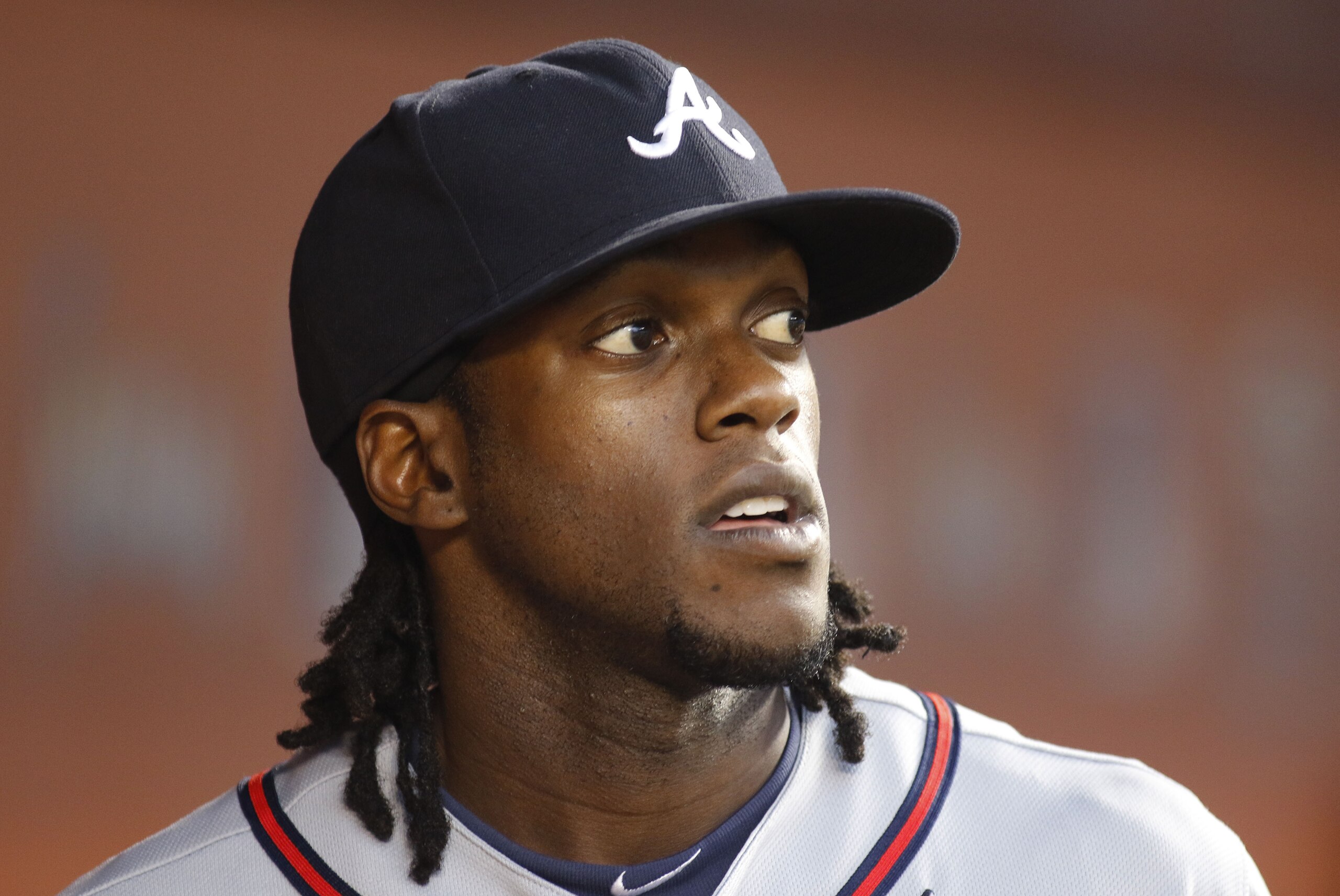 Atlanta Braves center fielder Cameron Maybin (25) looks to the field from the dugout as the Braves played the Miami Marlins in a baseball game in Miami, Saturday Sept. 26, 2015. (AP Photo/Joe Skipper)