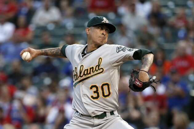 Oakland Athletics starting pitcher Jesse Chavez works against the Texas Rangers during the first inning of a baseball game Friday, Sept. 11, 2015, in Arlington, Texas. (AP Photo/Tony Gutierrez)