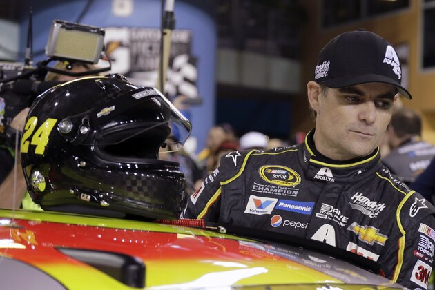 Jeff Gordon (24) prepares to get into his car before qualifying for the NASCAR Sprint Cup Series auto race Friday, Nov. 20, 2015, at Homestead-Miami Speedway in Homestead, Fla. (AP Photo/Terry Renna)
