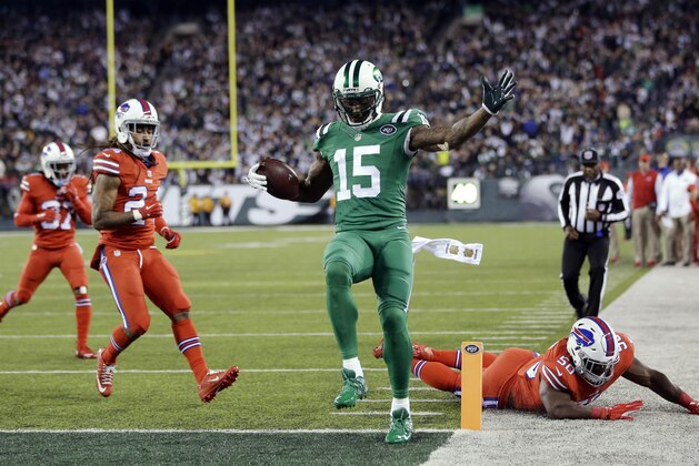 New York Jets wide receiver Brandon Marshall (15) scores on a touchdown reception against the Buffalo Bills during the second half of an NFL football game Thursday, Nov. 12, 2015, in East Rutherford, N.J. (AP Photo/Seth Wenig)