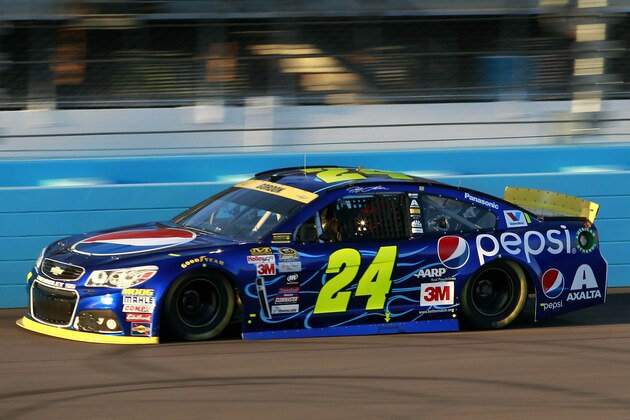 Jeff Gordon drives into Turn 1 during qualifying for Sunday's NASCAR Sprint Cup series auto race at Phoenix International Raceway, Friday, Nov. 13, 2015 in Avondale, Ariz. (AP Photo/Ralph Freso)