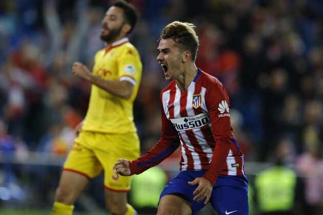 Atletico Madrid's Antoine Griezmann celebrates after scoring the opening goal against Sporting during the Spanish La Liga soccer match between Atletico Madrid and Sporting Gijon at the Vicente Calderon stadium in Madrid, Sunday, Nov. 8, 2015. Griezmann scored the winning goal in Atletico's 1-0 victory. (AP Photo/Francisco Seco)
