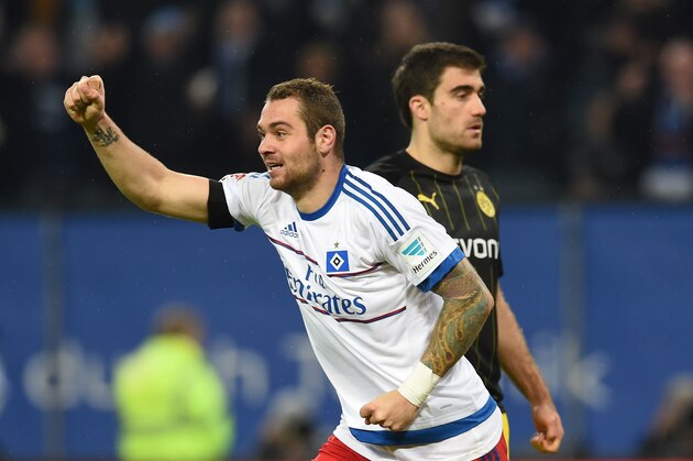 Hamburg's forward Pierre-Michel Lasogga celebrates after the 3-0 own goal scored by Dortmund's defender Mats Hummels during the German first division football Bundesliga match between Hamburg SV and Borussia Dortmund in Hamburg, northern Germany on November 20, 2015. AFP PHOTO / CARMEN JASPERSEN

RESTRICTIONS: DURING MATCH TIME: DFL RULES TO LIMIT THE ONLINE USAGE TO 15 PICTURES PER MATCH AND FORBID IMAGE SEQUENCES TO SIMULATE VIDEO. 
==RESTRICTED TO EDITORIAL USE ==
FOR FURTHER QUERIES PLEASE CONTACT THE DFL DIRECTLY AT + 49 69 650050.        (Photo credit should read CARMEN JASPERSEN/AFP/Getty Images)