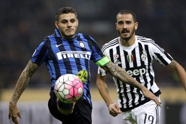 Inter Milan's Mauro Icardi, left, controls the ball ahead of Juventus' Leonardo Bonucci during the Serie A soccer match between Inter Milan and Juventus at the San Siro stadium in Milan, Italy, Sunday, Oct. 18, 2015. (AP Photo/Luca Bruno)