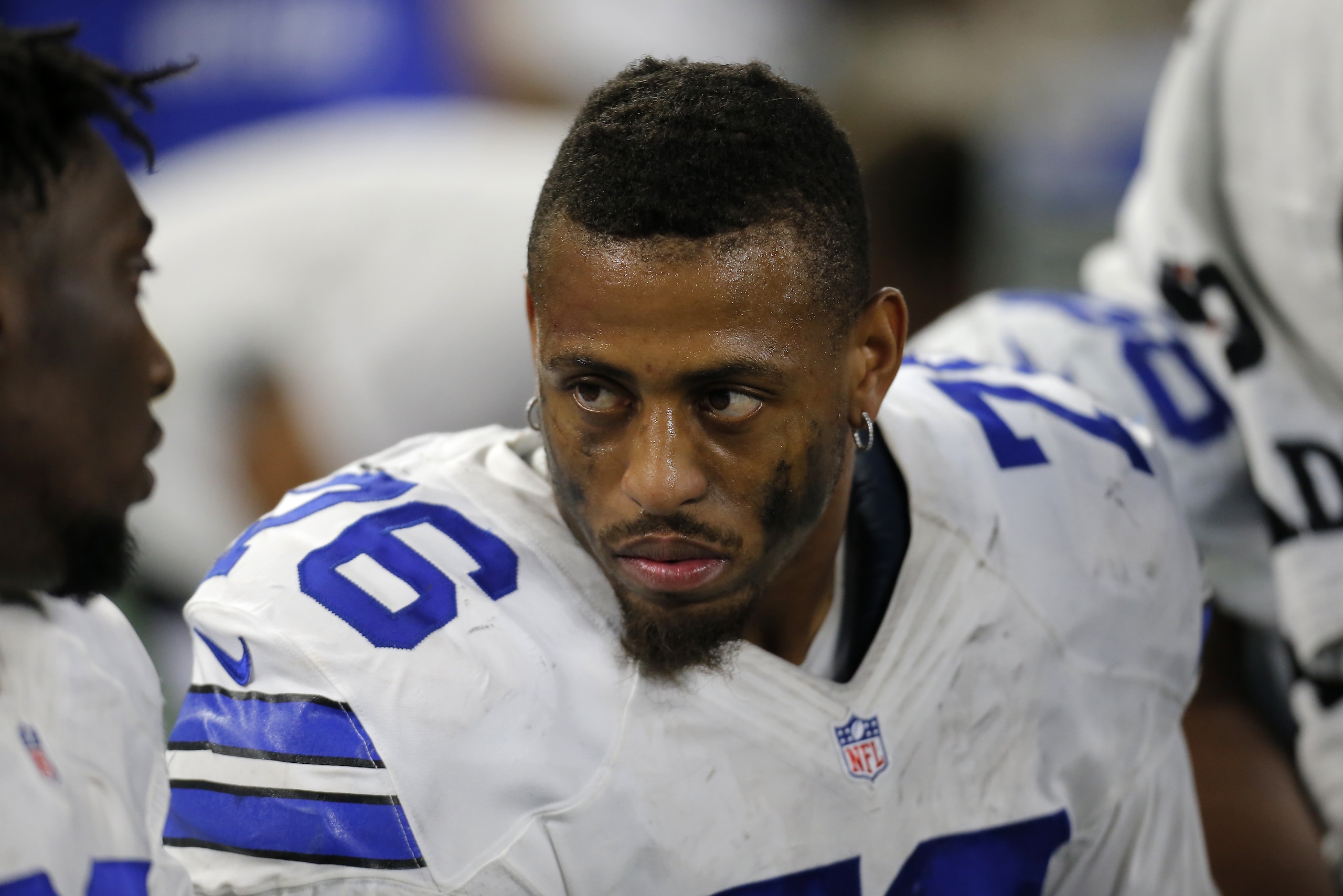 Dallas Cowboys' Greg Hardy (76) talks with teammates on the bench in the second half of an NFL football game against the Philadelphia Eagles on Sunday, Nov. 8, 2015, in Arlington, Texas. (AP Photo/Brandon Wade)