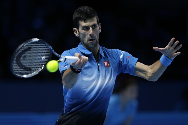 Serbia's Novak Djokovic plays a return to Spain’s Rafael Nadal during their ATP World Tour Finals tennis match at the O2 Arena in London, England, Saturday Nov. 21, 2015. (AP Photo/Tim Ireland)