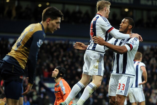 West Brom’s James McClean, centre, celebrates with teammate Solomon Rondon, right, after scoring against Arsenal during the English Premier League soccer match between West Bromwich Albion and Arsenal at the Hawthorns, West Bromwich, England, Saturday, Nov. 21, 2015. (AP Photo/Rui Vieira)
