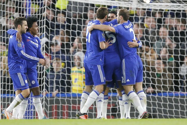 Chelsea's Diego Costa, right in center, celebrates with teammates after scoring  during the English Premier League soccer match between Chelsea and Norwich City at Stamford Bridge stadium in London, Saturday, Nov. 21, 2015. (AP Photo/Frank Augstein)