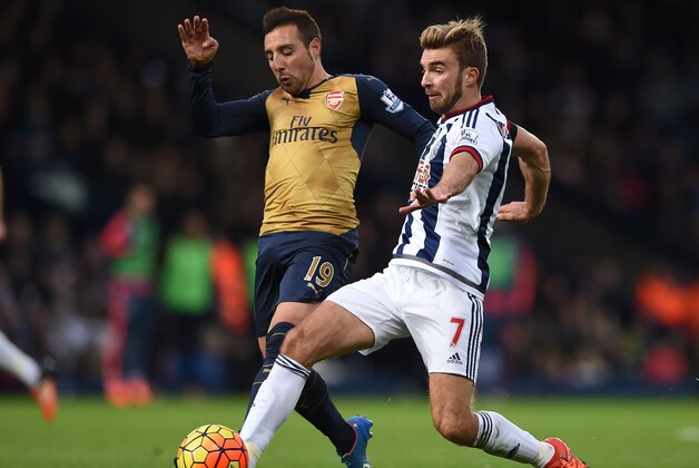 Arsenal's Spanish midfielder Santi Cazorla (L) vies with West Bromwich Albion's English-born Scottish midfielder James Morrison (R) during the English Premier League football match between West Bromwich Albion and Arsenal at The Hawthorns in West Bromwich, central England on November 21, 2015. AFP PHOTO / PAUL ELLIS

RESTRICTED TO EDITORIAL USE. No use with unauthorized audio, video, data, fixture lists, club/league logos or 'live' services. Online in-match use limited to 75 images, no video emulation. No use in betting, games or single club/league/player publications.        (Photo credit should read PAUL ELLIS/AFP/Getty Images)