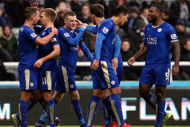 Leicester City's Jamie Vardy, center, celebrates his goal with his teammates during the English Premier League soccer match between Newcastle United and Leicester City at St James' Park, Newcastle, England, Saturday, Nov. 21, 2015. (AP Photo/Scott Heppell)