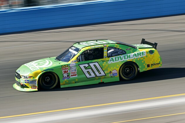 Series points leader Chris Buescher drives into Turn 2 during qualifying for Saturday's NASCAR Xfinity Series auto race at Phoenix International Raceway, Saturday, Nov. 14, 2015 in Avondale, Ariz. (AP Photo/Ralph Freso)