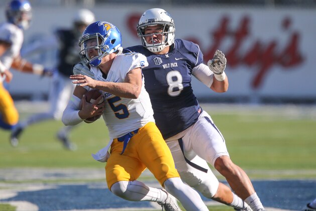 Nevada's Ian Seau pursues San Jose State's Kenny Potter in an NCAA college football game in Reno, Nev., on Saturday, Nov. 14, 2015. (AP Photo/Cathleen Allison)