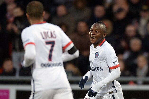 Paris Saint-Germain's French forward Hervin Ongenda (R) celebrates after scoring a goal during the French L1 football match between Lorient and Paris Saint-Germain on November 21, 2015 at the Moustoir stadium in Lorient, western France. AFP PHOTO / JEAN-SEBASTIEN EVRARD        (Photo credit should read JEAN-SEBASTIEN EVRARD/AFP/Getty Images)