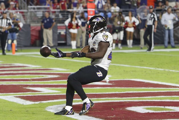 Baltimore Ravens running back Justin Forsett (29) runs in for a touchdown against the Arizona Cardinals during the first half of an NFL football game, Monday, Oct. 26, 2015, in Glendale, Ariz. (AP Photo/Rick Scuteri)