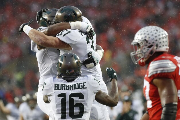 Nov 21, 2015; Columbus, OH, USA; Michigan State Spartans fullback Trevon Pendleton (37) celebrates with Spartans quarterback Damion Terry (6) after scoring a touchdown against the Ohio State Buckeyes in the second quarter at Ohio Stadium. Mandatory Credit: Geoff Burke-USA TODAY Sports
