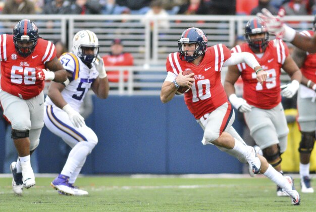 Nov 21, 2015; Oxford, MS, USA; Mississippi Rebels quarterback Chad Kelly (10) runs the ball during the first quarter of the game against the LSU Tigers at Vaught-Hemingway Stadium. Mandatory Credit: Matt Bush-USA TODAY Sports