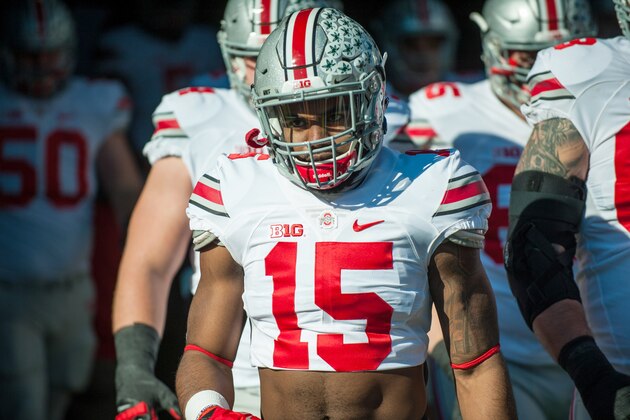 Ohio State running back Ezekiel Elliott (15) takes the field for warm ups before an NCAA football game against Illinois Saturday, Nov. 14, 2015 at Memorial Stadium in Champaign, Ill.  Ohio State won 28-3.  (AP Photo/Bradley Leeb)