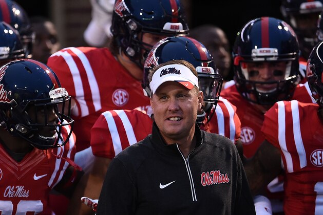 OXFORD, MS - OCTOBER 24:  Head coach Hugh Freeze of the Mississippi Rebels leads his team onto the field prior to a game against the Texas A&M Aggies at Vaught-Hemingway Stadium on October 24, 2015 in Oxford, Mississippi. Mississippi defeated Texas A&M 23-3.  (Photo by Stacy Revere/Getty Images)