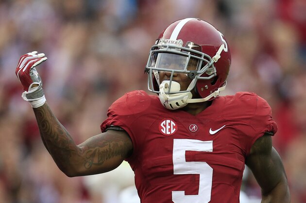 Nov 21, 2015; Tuscaloosa, AL, USA; Alabama Crimson Tide defensive back Cyrus Jones (5) celebrates after returning  a punt for a touchdown against Charleston Southern Buccaneers  at Bryant-Denny Stadium. Mandatory Credit: Marvin Gentry-USA TODAY Sports