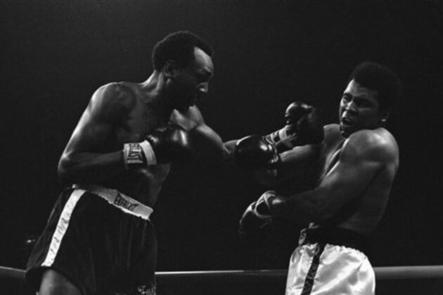 Bob Foster connects with a left to the face of Muhammad Ali during their bout at the Sahara Tahoe Hotel in Stateline, Nevada on Nov. 21, 1972.   Ali knocked out Foster in the eighth round. (AP Photo)