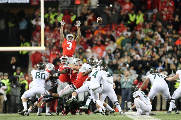 COLUMBUS, OH - NOVEMBER 21: Michael Geiger #4 of the Michigan State Spartans kicks the game winning field goal against the Ohio State Buckeyes at Ohio Stadium on November 21, 2015 in Columbus, Ohio. Michigan State defeated Ohio State 17-14. (Photo by Rey Del Rio/Getty Images)
