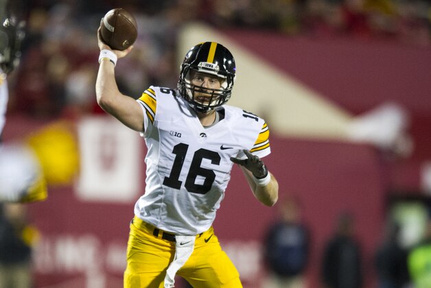 Iowa quarterback C.J. Beathard (16) draws back to throw against Indiana during the second half of an NCAA college football game in Bloomington, Ind., Saturday, Nov. 7, 2015. Iowa won 35-27. (AP Photo/Doug McSchooler)